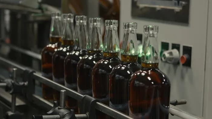 Bottles of bourbon moving along the filling line