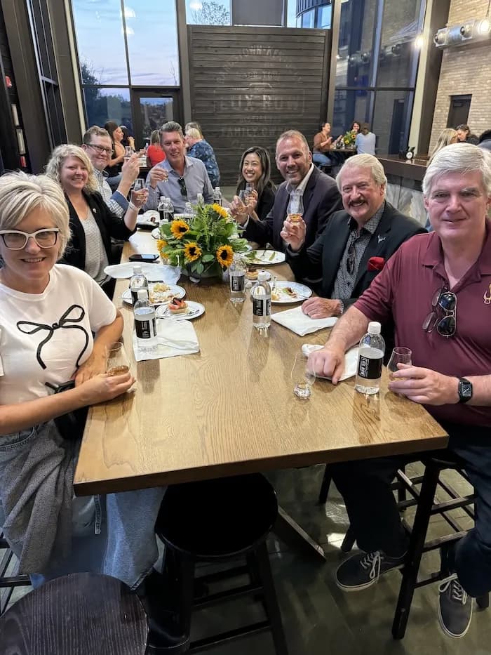 Friends raising a toast around a table